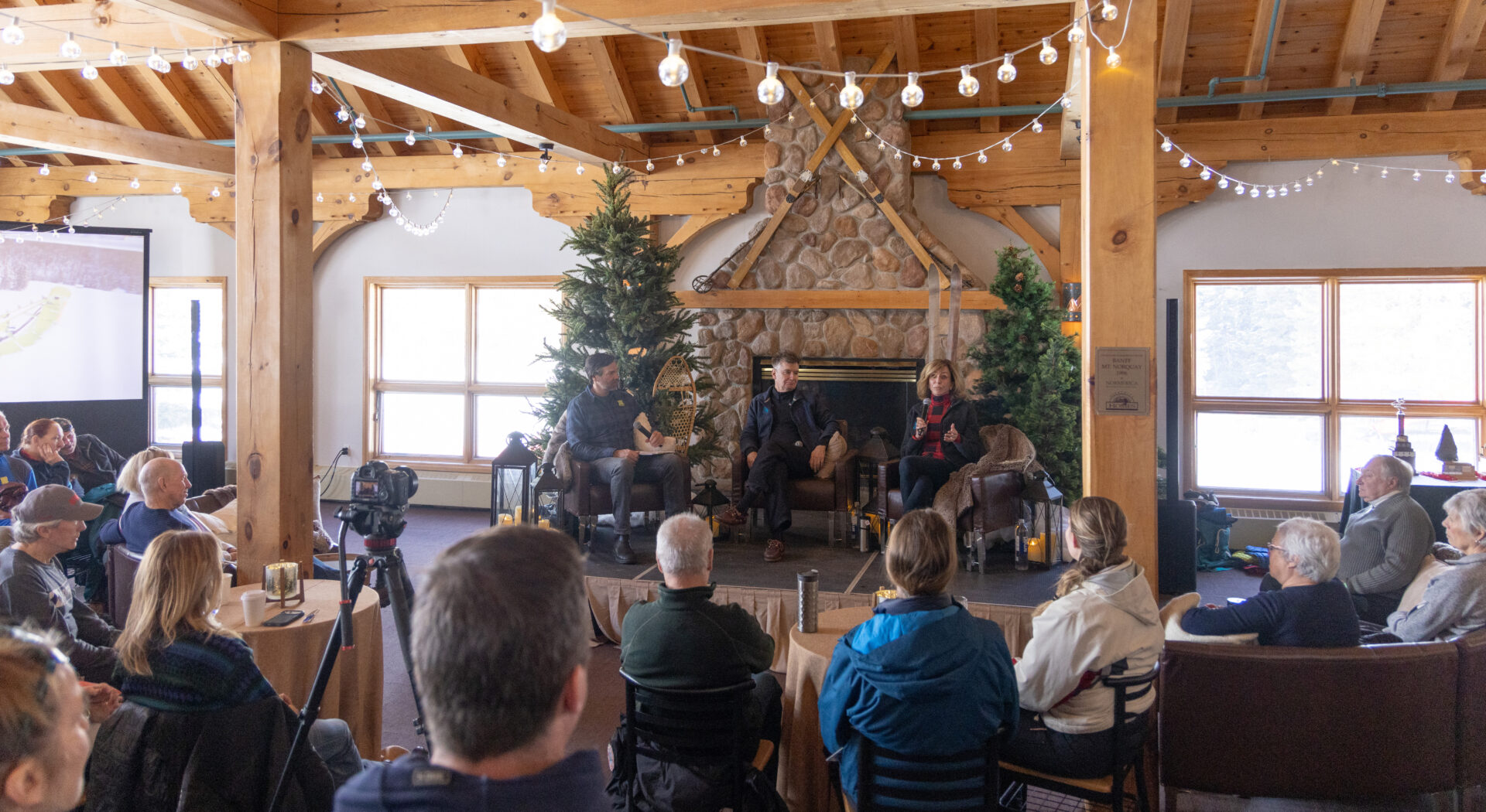 Guests enjoy a live holiday concert inside Norquays historic rustic lodge.